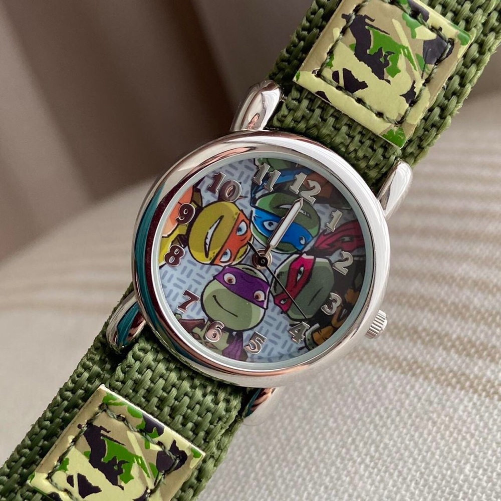 SOLD! Teenage Mutant Ninja Turtles green camouflage analog watch.